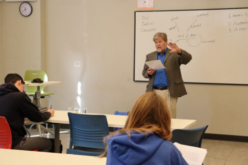 Dr. Greg Ganssle with Pacifica High students