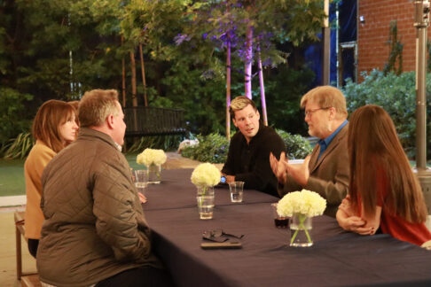 Dr. Greg Ganssle at a table discussion